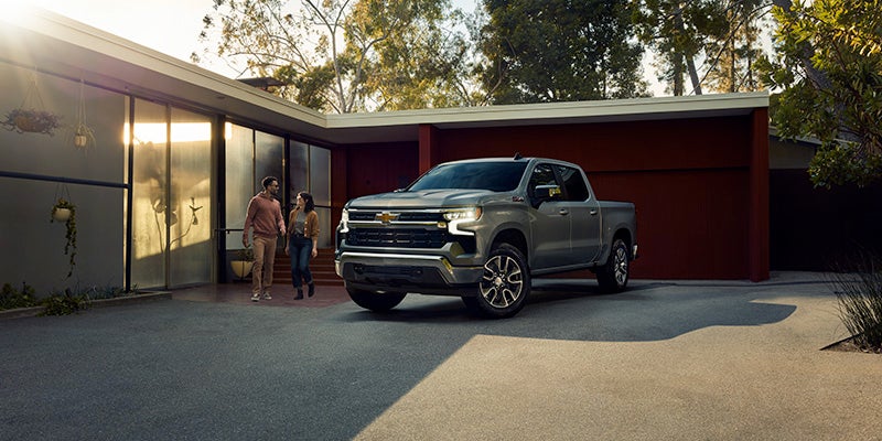 New 2025 Chevrolet Silverado 1500 parked near a house