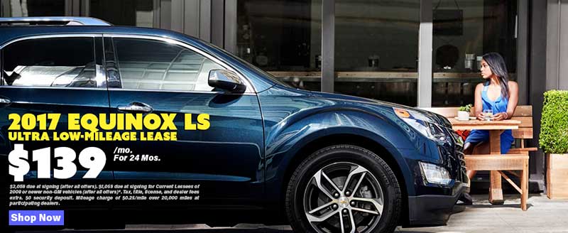 A dark blue Chevy Equinox parked in the city
